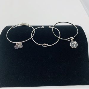 Combo of three silver tone bracelets.